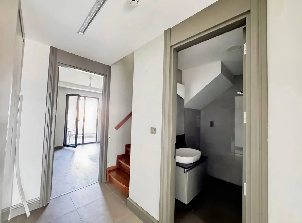 Hallway, staircase and bathroom entrance