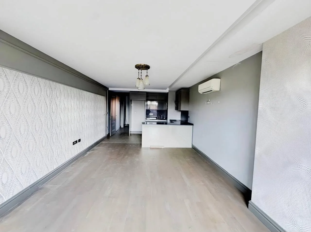 Upper-floor living room and kitchen