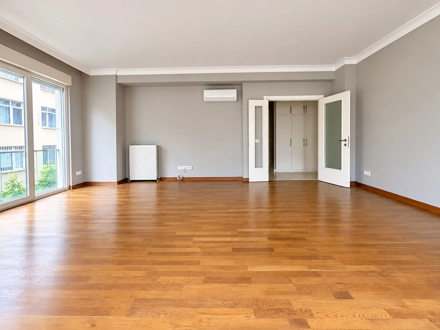 Another view of the living room and entrance